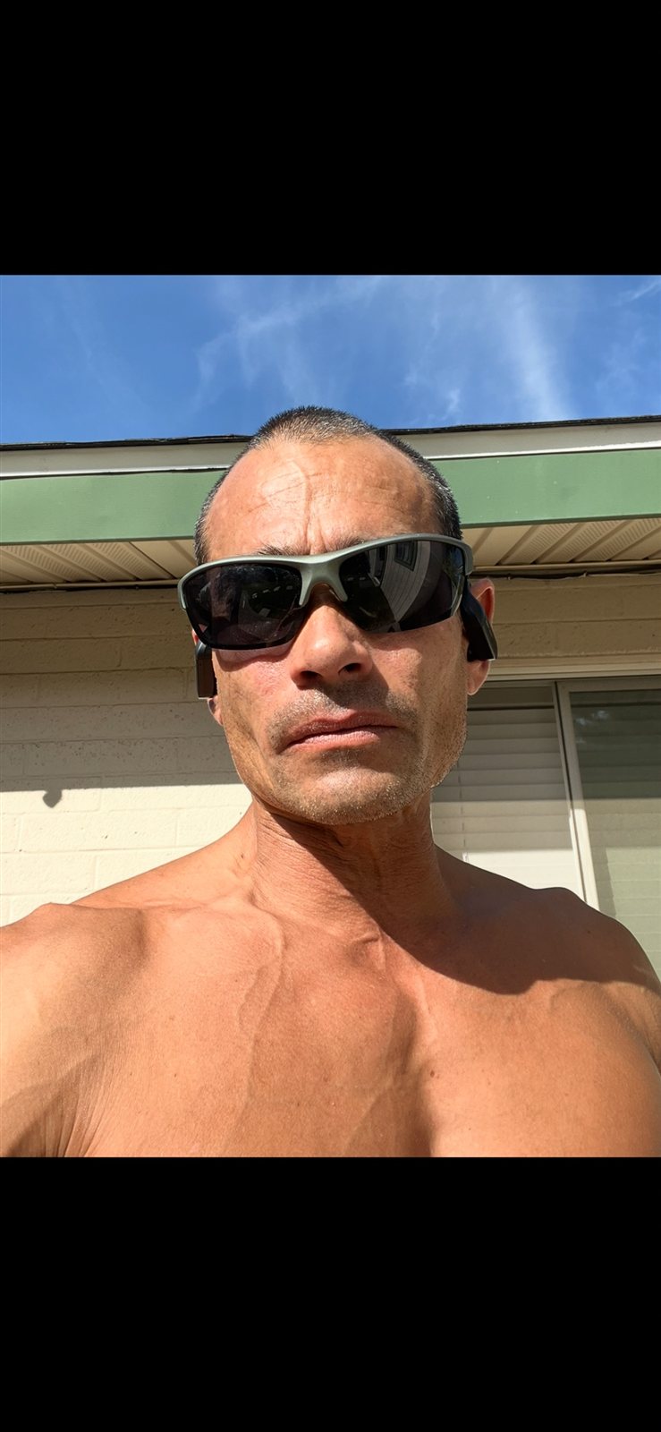 Clinton Knopp outdoor SuperXCentric fitness portrait with sunglasses